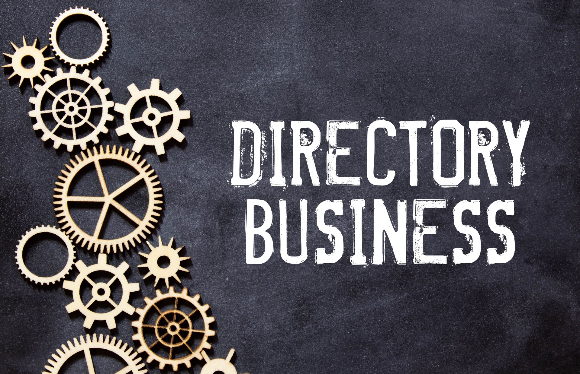 A sheet of craft paper with DIRECTORY BUSINESS text attached to a white textured wall with a button.